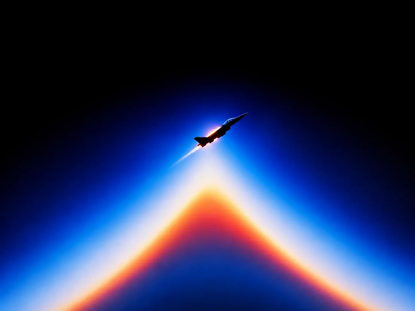 Tiny futuristic jet suspended high above a gigantic glowing horizon, viewed from far below, enormous abstract triangular wave of luminous blue, white, orange and crimson light rising from the bottom of the frame, almost completely black upper sky, intense central glow fading smoothly into deep cobalt blue, soft atmospheric diffusion, heavy bloom around the light, minimal geometric composition, surreal scale, retro-futuristic visual language, experimental long-exposure photography, subtle grain, 16:9. STYLE LOCK: surreal retro-futuristic aviation photography, extreme minimalism, enormous negative space, tiny subject against monumental scale, electric cobalt blue and deep indigo palette, black voids, luminous white cores, orange and magenta chromatic fringes, long-exposure light trails, smooth atmospheric gradients, heavy optical bloom, soft diffusion, slight chromatic aberration, subtle analog film grain, dreamy experimental photography, high contrast, abstract geometric perspective, no realistic environment, no text, no UI, no stars, cinematic composition