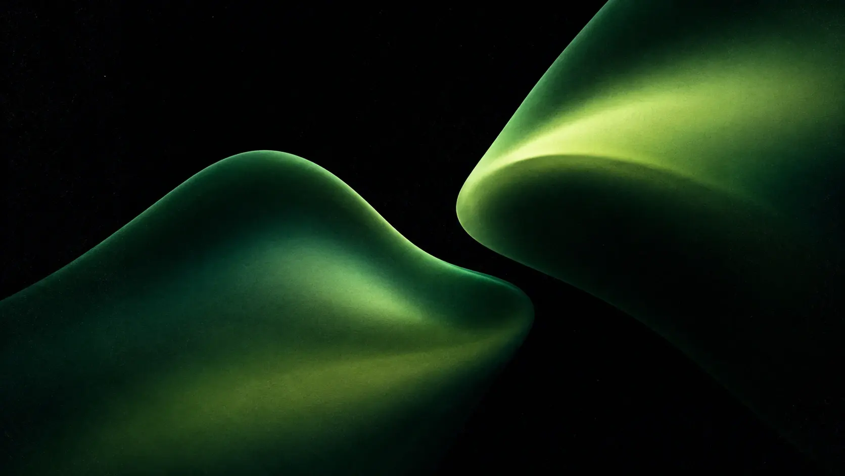 Abstract experimental gradient artwork, 16:9 landscape, deep pure black background, two enormous translucent organic folds floating diagonally across the frame, one sweeping upward from the lower left and another descending from the upper right, soft rounded surfaces with no hard geometry, dark emerald green transitioning into moss, pale lime and muted chartreuse highlights, deep black shadows between the folds, subtle atmospheric glow, soft-focus edges, fine analog film grain, slightly dusty texture, elegant minimal composition, futuristic editorial aesthetic, no objects, no text