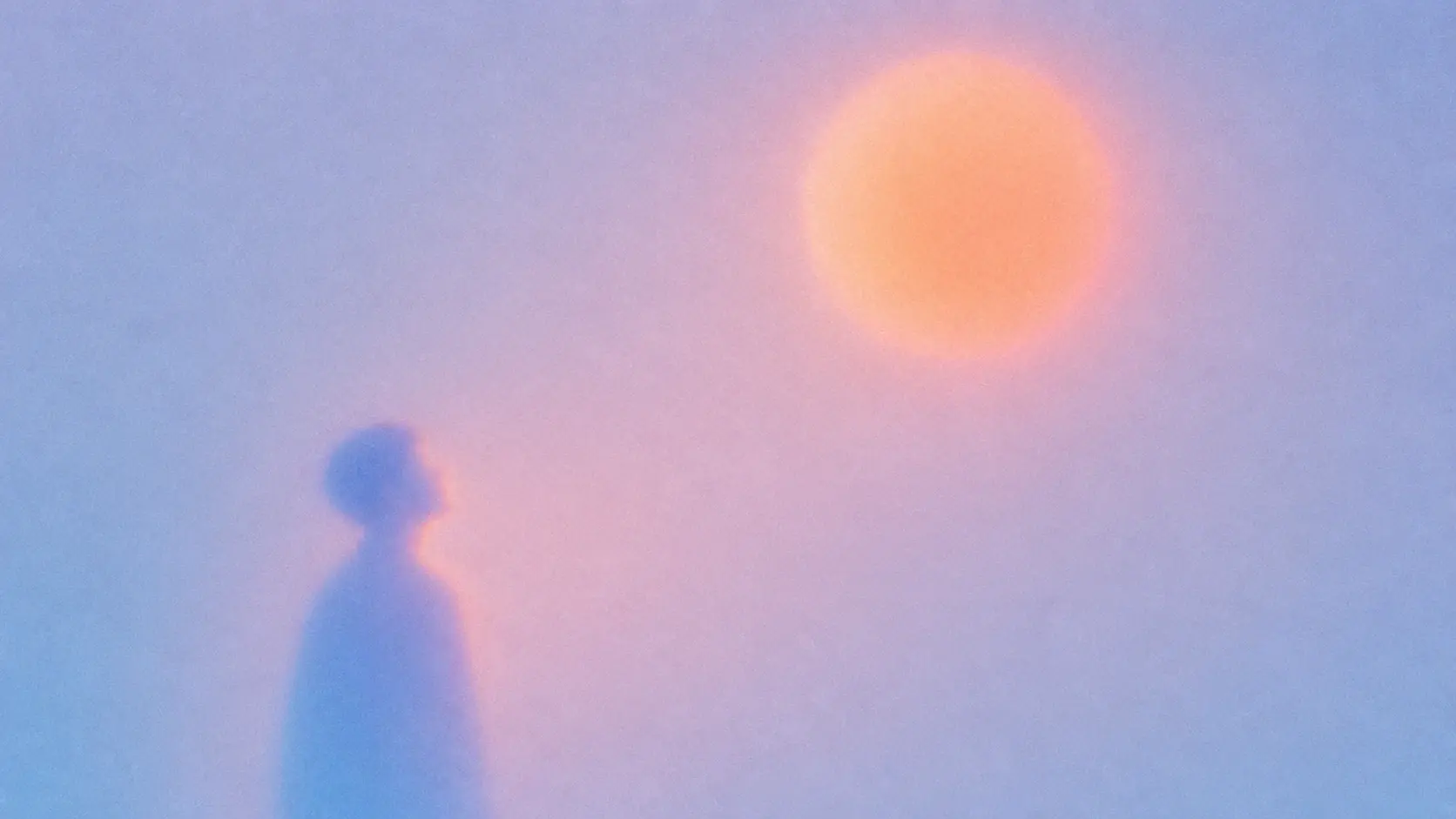 A large soft human silhouette standing near the bottom-left of the frame, looking upward toward one enormous floating peach-orange circular shape in the upper-right, the silhouette washed in cyan blue and lavender, the circular shape glowing intensely and bleeding into the surrounding pink haze, huge empty atmospheric space, extremely simple composition. STYLE LOCK